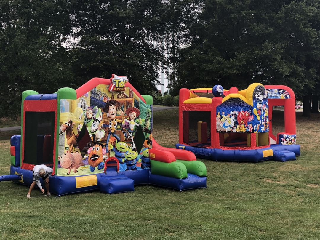 05 themed units crew setup park School Field Day Bounce House Rentals